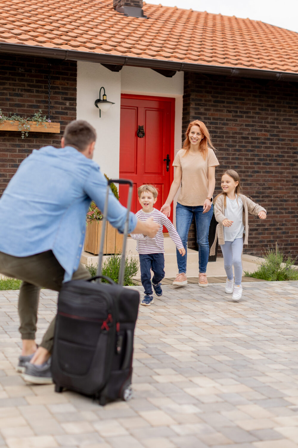 man returning home to family
